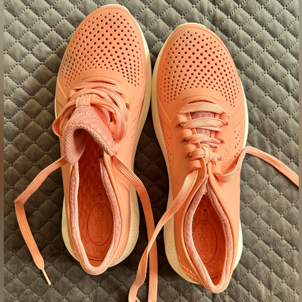Crocs Lite Ride coral colored sneakers